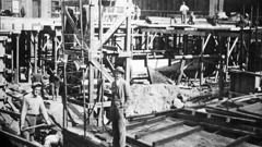 Irmãos em um canteiro de obras trabalhando no alicerce de um novo prédio.