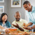 A group of Witnesses enjoying a meal together in someone’s home.