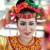 An Indonesian woman puts on a native headdress