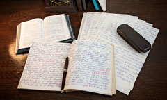 Handwritten copies of The Watchtower and Examining the Scriptures Daily in Georgian
