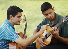Bruno giving a guitar lesson