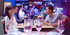 Two married couples having a meal at a restaurant