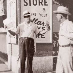 Thomas McLain’s father offers magazines on a street corner