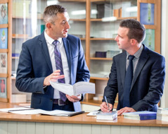 A congregation elder talks with a ministerial servant