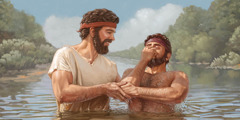 Yohanes Pembaptis sedang membaptis seorang lelaki di sungai.