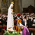 Pope Francis bowing before a statue of Mary.