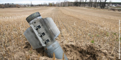 An unexploded missile that has crashed into a Ukrainian agricultural field.