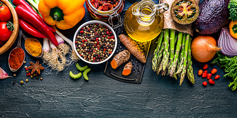 A variety of fruits, vegetables, and spices.