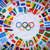 The Olympic symbol surrounded by the flags of many nations.