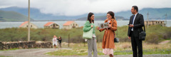 Two of Jehovah’s Witnesses preaching to a woman on a road near Lake Sevan.