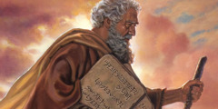 Moses carrying stone tablets