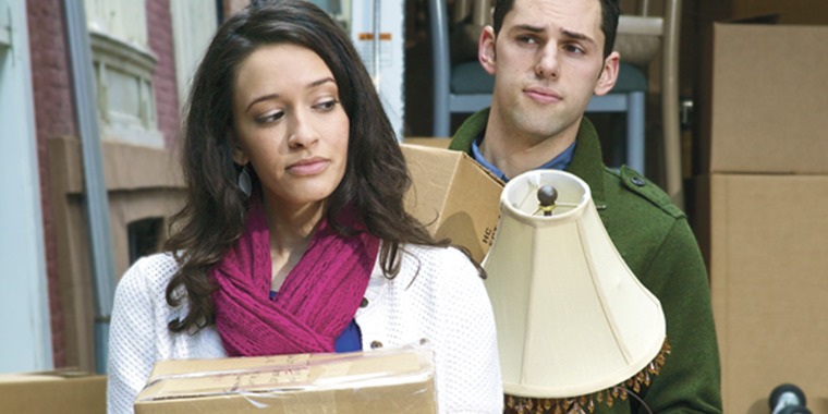 A man and woman moving in together