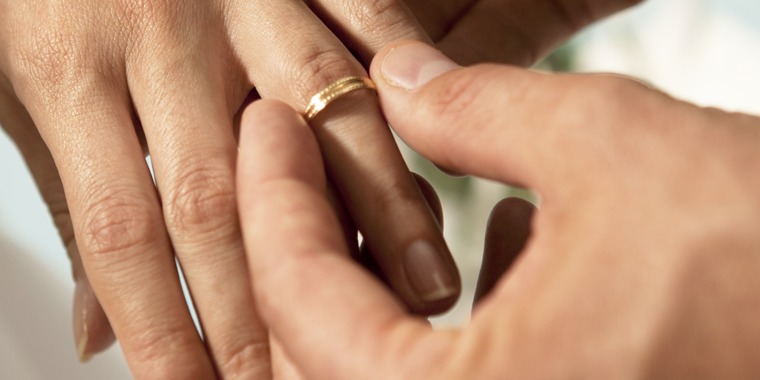 Hands of a bride and groom