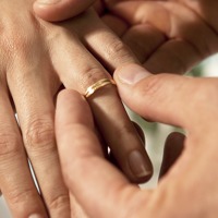 Hands of a bride and groom