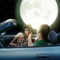 A young couple alone in a car