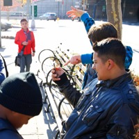 A boy being invited by other boys to view pornography on a cell phone