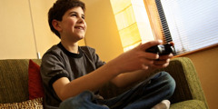 A young boy playing a video game