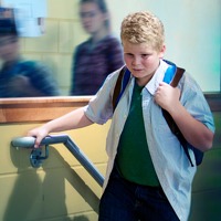 A teenage boy feeling anxious at school