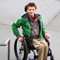 A teenage boy confined to a wheelchair