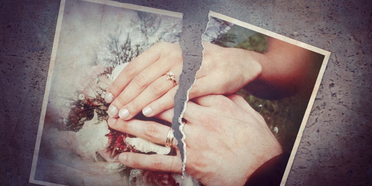 A wedding photo torn in half