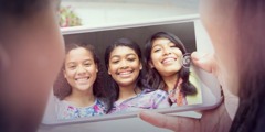 Teenage girls pose for a selfie