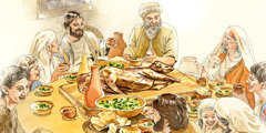 聖書時代の家族が過ぎ越しの食事をしている。