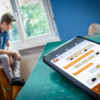 A young man is depressed after being cyberbullied