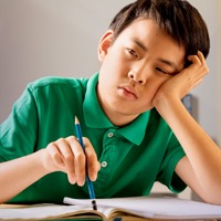 A boy struggles with his homework