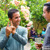 Mario Antúnez using Honduras Sign Language (LESHO) to communicate with a brother at a social gathering.