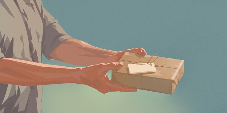 A man holds a gift-wrapped box