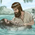 Yohanes Pembaptis membaptis seorang pria.