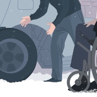 Bob sits in his wheelchair on the side of the highway as a young Witness change his tire