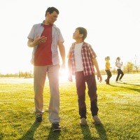 A father talks with his young son