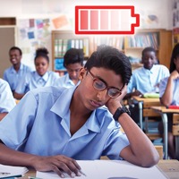 A teenage boy falls asleep in a classroom