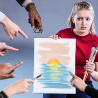Several people criticizing a young girl’s piece of art.