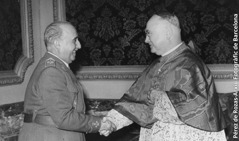Francisco Franco shaking hands with a Catholic cardinal.