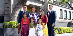 An indigenous Witness family and brothers from the Central America branch, standing outside the Supreme Court in Mexico City.
