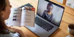 A sister using the book to conduct a Bible study via videoconferencing.